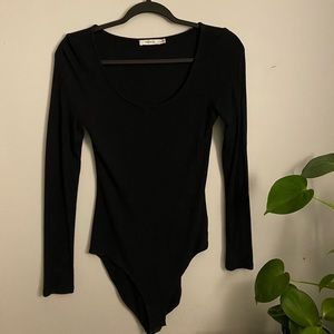 Like new black long-sleeve bodysuit from Ricki’s.
